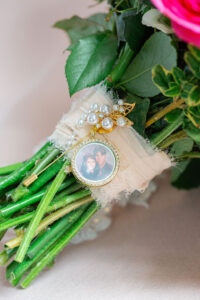bridal flatlay memorial photo on bouquet